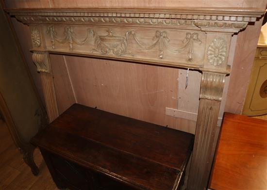 A carved pine fire surround W.138cm